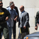 Baltimore Police Lt. Brian Rice (center) is escorted from the courthouse to a waiting car after being found not guilty on all charges related to the death of Freddie Gray on July 18, 2016, in Baltimore.
Jerry Jackson/Baltimore Sun/TNS via Getty Images